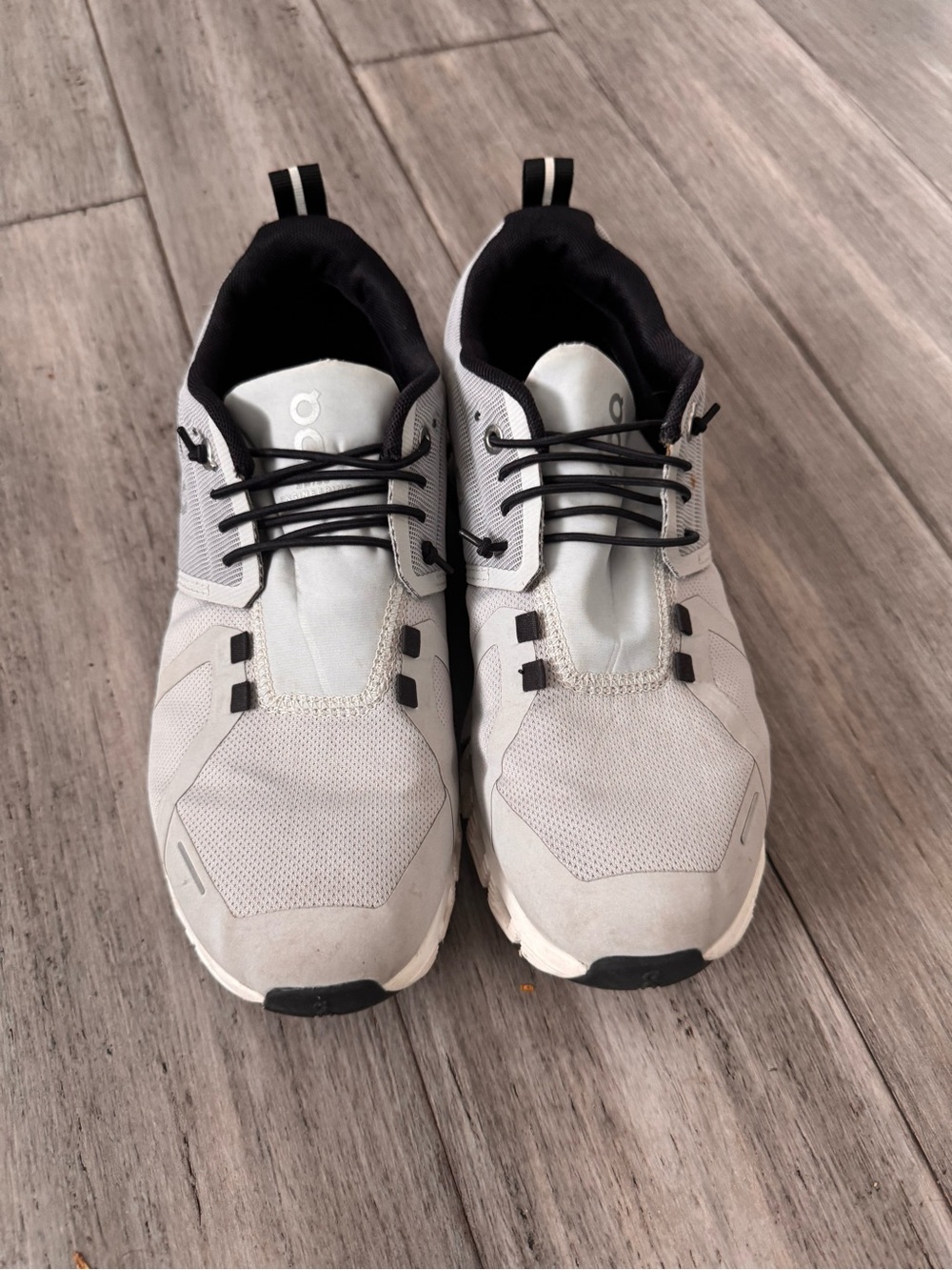 On Running Light Gray and Black women’s Sneakers